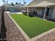 Artificial turf, pool, desert landscaping, patio, and built in outdoor kitchen at 9612 N 52Nd Dr, Glendale, AZ 85302