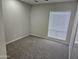 A cozy bedroom is carpeted with natural light coming through the window at 9612 N 52Nd Dr, Glendale, AZ 85302