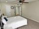 Spacious carpeted bedroom with ceiling fan, ensuite door and ample natural light at 9612 N 52Nd Dr, Glendale, AZ 85302