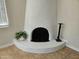 Close-up of a striking curved fireplace in the living room at 9612 N 52Nd Dr, Glendale, AZ 85302