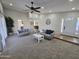 Spacious living room with neutral walls, plush carpet, stylish sofas, decor, and a front door at 9612 N 52Nd Dr, Glendale, AZ 85302