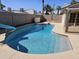 A private backyard pool with a slide, surrounded by a concrete patio and block wall at 9612 N 52Nd Dr, Glendale, AZ 85302