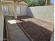 Cozy side yard featuring a neutral color scheme and desert rock landscaping that requires very little maintenance at 9612 N 52Nd Dr, Glendale, AZ 85302
