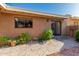 Cozy backyard with a tiled patio, landscaping, and neutral tones at 1010 E Lois Ln, Phoenix, AZ 85020