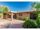 Cozy backyard with patio, and beautiful landscaping that offers privacy and charm at 1010 E Lois Ln, Phoenix, AZ 85020