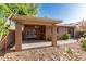 Outdoor patio with a ceiling fan, and neutral tones overlooking a serene landscaped yard at 1010 E Lois Ln, Phoenix, AZ 85020