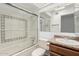 Bathroom featuring shower over tub, vanity, and mirror at 1010 E Lois Ln, Phoenix, AZ 85020