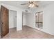 Bedroom featuring ceiling fan, tile floor, closet and natural light at 1010 E Lois Ln, Phoenix, AZ 85020