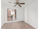 Bright bedroom featuring a ceiling fan and a large window at 1010 E Lois Ln, Phoenix, AZ 85020