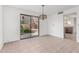 Bright dining room with sliding glass doors leading to an outdoor patio at 1010 E Lois Ln, Phoenix, AZ 85020