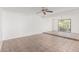 Bright living room with tile flooring and large windows overlooking the backyard at 1010 E Lois Ln, Phoenix, AZ 85020