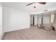 Open concept living room with neutral tile floors, fireplace, and access to other rooms at 1010 E Lois Ln, Phoenix, AZ 85020