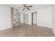 Spacious living room with tile flooring, ceiling fan, and lots of natural light at 1010 E Lois Ln, Phoenix, AZ 85020