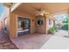 Inviting patio with tiled flooring and a convenient pass-through window, perfect for outdoor entertaining at 1010 E Lois Ln, Phoenix, AZ 85020