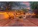Enchanting backyard with a string-lit outdoor dining area, perfect for entertaining under the stars at 10811 W Avenida Del Rey --, Peoria, AZ 85383