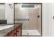 Modern bathroom features a stand up shower with sliding glass door, granite counters, and fixtures at 10811 W Avenida Del Rey --, Peoria, AZ 85383