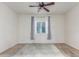 Spacious bedroom with a ceiling fan, plush carpet, and window at 10811 W Avenida Del Rey --, Peoria, AZ 85383