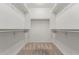 Walk-in closet with carpeted floors and white shelving provides organized storage space at 10811 W Avenida Del Rey --, Peoria, AZ 85383