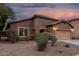 Single Gathering home with two-car garage, stone accents, and desert landscaping at 10811 W Avenida Del Rey --, Peoria, AZ 85383