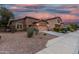 Single Gathering home with a two-car garage, desert landscaping and cozy front porch at 10811 W Avenida Del Rey --, Peoria, AZ 85383
