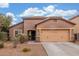 Charming single-Gathering home featuring a two-car garage and low-maintenance desert landscaping at 10811 W Avenida Del Rey --, Peoria, AZ 85383