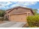 Two-car garage with desert landscaping and plants in the front yard of a house at 10811 W Avenida Del Rey --, Peoria, AZ 85383