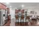 Modern kitchen featuring stainless steel appliances, dark wood cabinets, and a breakfast bar with seating at 10811 W Avenida Del Rey --, Peoria, AZ 85383