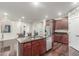Modern kitchen featuring a center island with a sink, stainless steel appliances, and beautiful wood flooring at 10811 W Avenida Del Rey --, Peoria, AZ 85383