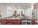 Kitchen island with granite countertops, stainless steel sink, and seating, perfect for entertaining at 10811 W Avenida Del Rey --, Peoria, AZ 85383