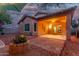 Beautifully landscaped patio with string lights, a covered area, BBQ, and mature bougainvillea at 10811 W Avenida Del Rey --, Peoria, AZ 85383