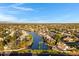 Breathtaking aerial view featuring waterfront homes along a tranquil canal under a vast, open sky at 1120 E Harbor View Dr, Gilbert, AZ 85234