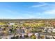 Scenic aerial view of a community with a lake, baseball field, and lush green spaces at 1120 E Harbor View Dr, Gilbert, AZ 85234