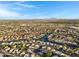 Scenic aerial shot of a neighborhood with waterfront properties, mature trees, and a community connected by canals at 1120 E Harbor View Dr, Gilbert, AZ 85234