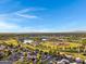 Panoramic aerial view showcasing a community with parks, a lake, and sports fields at 1120 E Harbor View Dr, Gilbert, AZ 85234