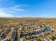 Scenic aerial view showcases a residential community with lakes, and well-maintained landscapes on a bright day at 1120 E Harbor View Dr, Gilbert, AZ 85234