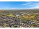 High aerial view displays a community with a central park with waterways, sports fields, and attractive landscaping at 1120 E Harbor View Dr, Gilbert, AZ 85234