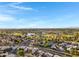 Expansive aerial view of a community featuring green spaces, a lake, and recreational areas at 1120 E Harbor View Dr, Gilbert, AZ 85234
