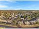Panoramic aerial view of a residential area, displaying houses, streets, and surrounding greenery under a clear blue sky at 1120 E Harbor View Dr, Gilbert, AZ 85234