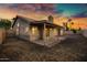 Rear exterior featuring a covered patio with access to the backyard at 1120 E Harbor View Dr, Gilbert, AZ 85234