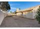 Large backyard with a covered patio and a wall surrounding the perimeter at 1120 E Harbor View Dr, Gilbert, AZ 85234