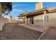 Backyard featuring a covered patio, grassy area, and block wall for privacy at 1120 E Harbor View Dr, Gilbert, AZ 85234