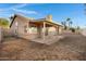 Covered patio and grassy backyard, ideal for relaxation and entertaining outdoors at 1120 E Harbor View Dr, Gilbert, AZ 85234