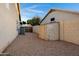 Fenced backyard with gravel and storage shed at 1120 E Harbor View Dr, Gilbert, AZ 85234