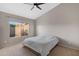 Bedroom with large window and ceiling fan, offering natural light and comfort at 1120 E Harbor View Dr, Gilbert, AZ 85234