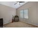 Bedroom with a ceiling fan and window overlooking the side yard at 1120 E Harbor View Dr, Gilbert, AZ 85234