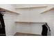 Walk in closet with ample shelving and clothing racks at 1120 E Harbor View Dr, Gilbert, AZ 85234