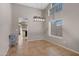 Open dining room with tile floors, modern light fixture, and direct access to the kitchen at 1120 E Harbor View Dr, Gilbert, AZ 85234