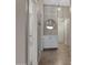 Hallway with tile flooring and a built-in cabinet, leading to the bathroom at 1120 E Harbor View Dr, Gilbert, AZ 85234