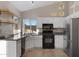 Well-lit kitchen featuring granite counters, stainless appliances, and ample cabinet space at 1120 E Harbor View Dr, Gilbert, AZ 85234