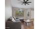 Cozy living room with tile flooring, a comfortable sofa, and lots of natural light at 1120 E Harbor View Dr, Gilbert, AZ 85234